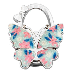 🦋👜【Compra uno y llévate otro gratis】Gancho plegable para bolso con forma de mariposa colorida