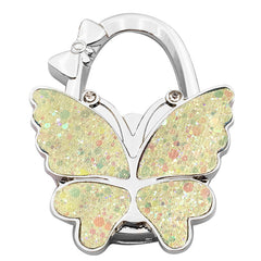 🦋👜【Compra uno y llévate otro gratis】Gancho plegable para bolso con forma de mariposa colorida