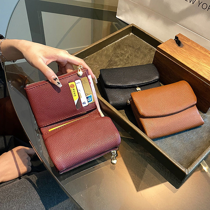 🔥✨【Compra 1 y llévate 1 gratis】⏰Cartera unisex Pebble de piel auténtica con protección RFID🔥