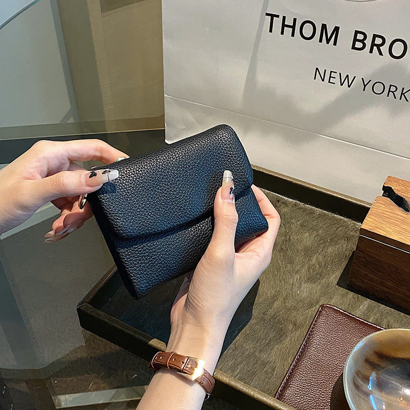 🔥✨【Compra 1 y llévate 1 gratis】⏰Cartera unisex Pebble de piel auténtica con protección RFID🔥