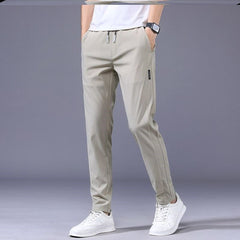 🔥【Compra uno y llévate otro gratis】💥【M-5XL】Pantalones casuales de verano para hombre, color liso, elásticos, de seda helada