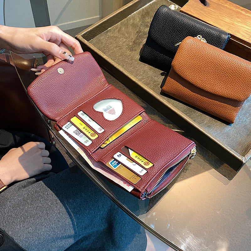 🔥✨【Compra 1 y llévate 1 gratis】⏰Cartera unisex Pebble de piel auténtica con protección RFID🔥